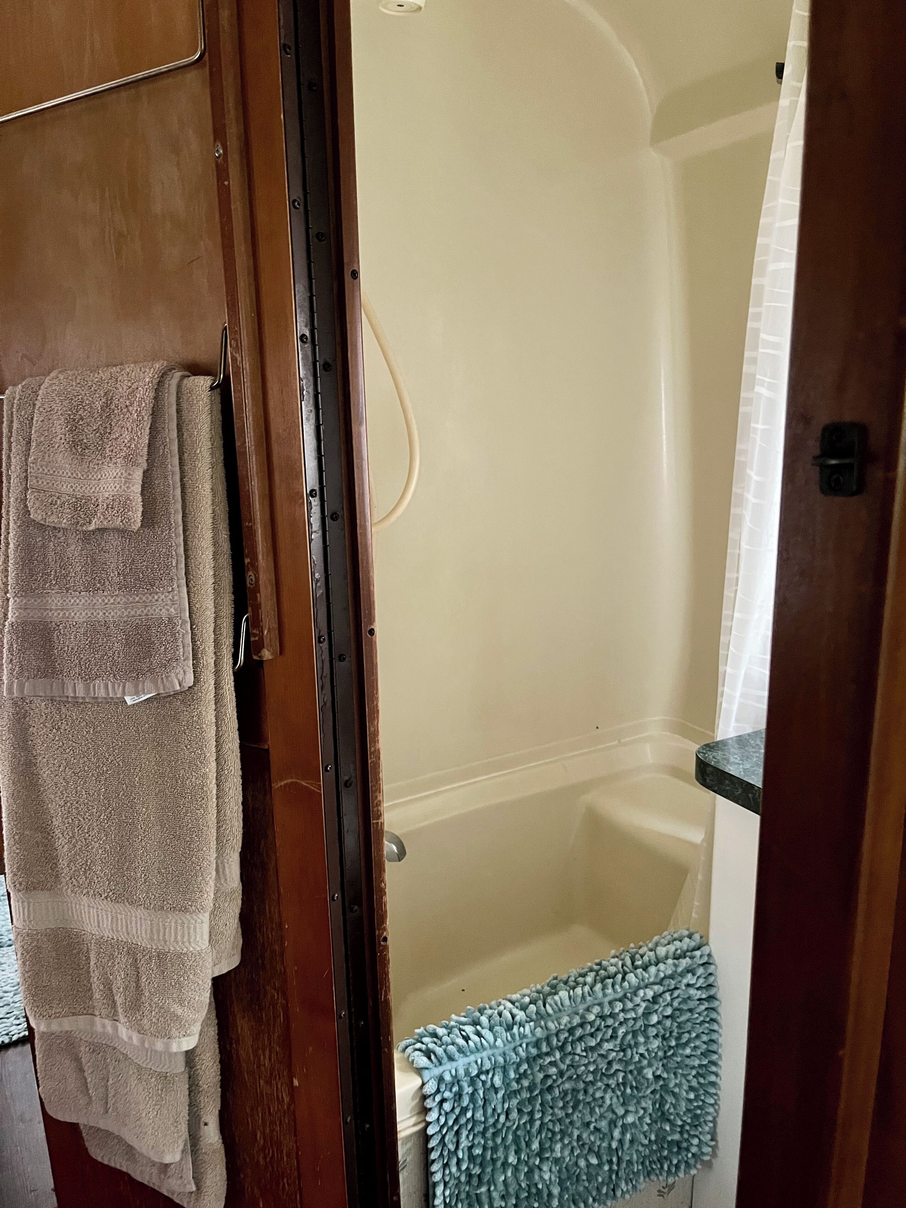 Combined shower/tub, towels, soap, toilet paper