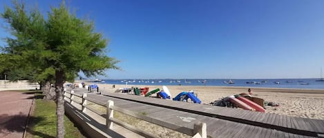 On the beach, sun-loungers