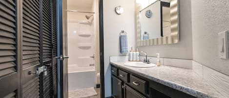 Bathtub, hair dryer, towels, soap