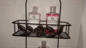 Shower, towels, soap, toilet paper