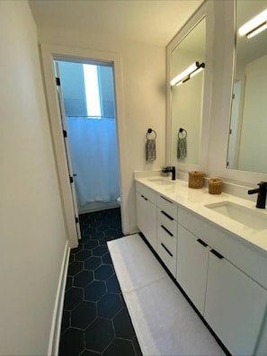 Combined shower/tub, hair dryer, towels, soap