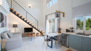 A modern interior with a staircase, dining area, kitchen, and living room. - Vertzami Villa just 2km from Lefkada city center (Lefkada)
