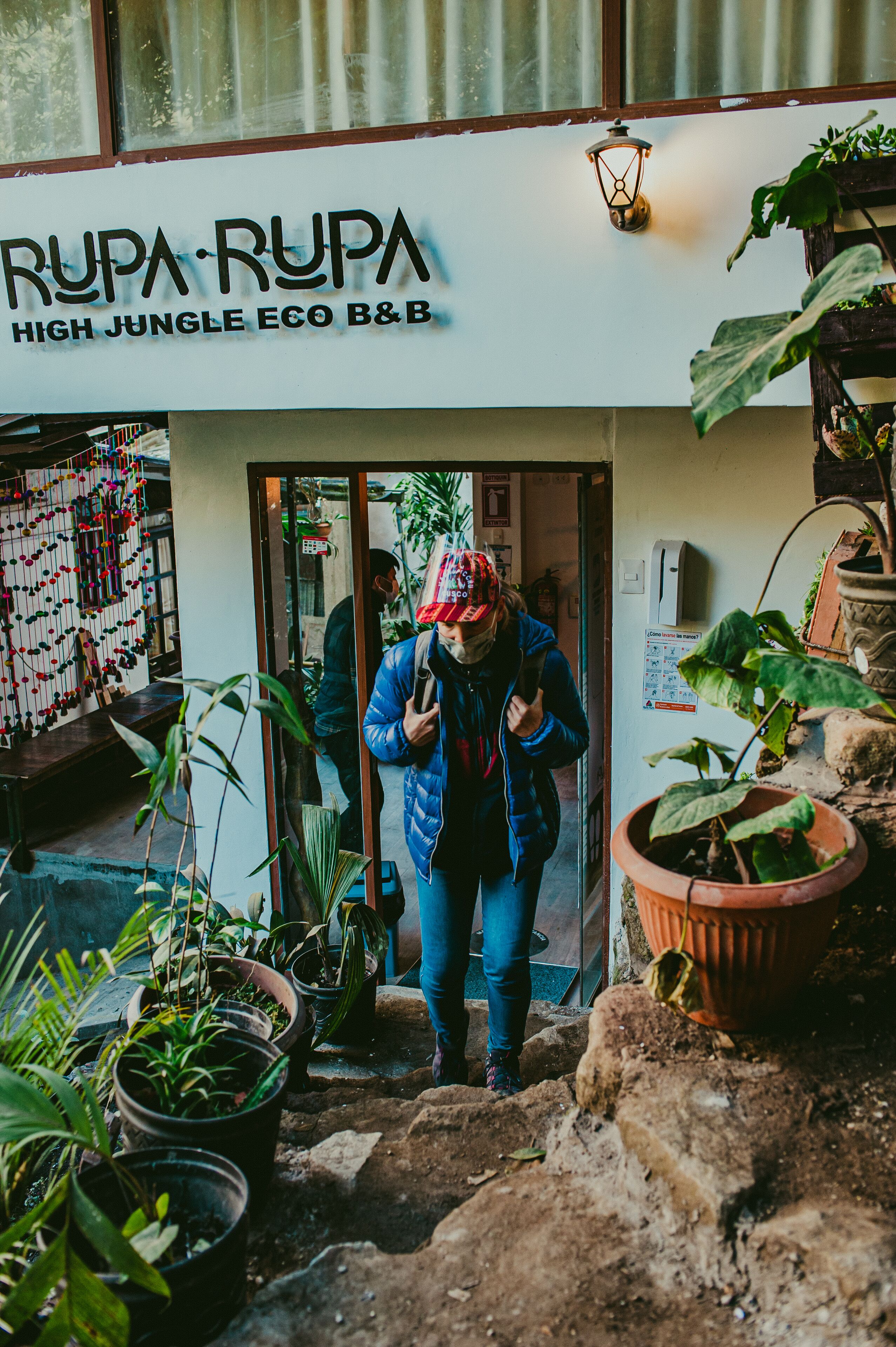 A storefront with the sign "Rupa-Rupa High Jungle Eco B&B".