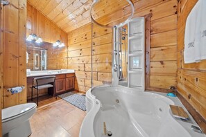 Combined shower/bathtub, jetted bath, towels, soap - Spacious Cabin w/Hot Tub + Arcade + Great Location (Sevierville)