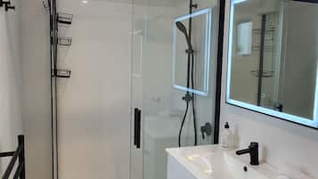 Combined shower/tub, hair dryer, towels, soap
