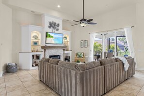 TV, fireplace, DVD player, stereo - Luxury Villa, Amazing Sunsets, Heated Pool & Spa, Game Room, Kayaks -Villa Coral Breeze- Roelens (Cape Coral)