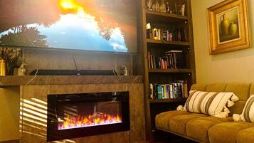 Smart TV, fireplace, DVD player, books