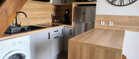 Fridge, microwave, stovetop, coffee/tea maker