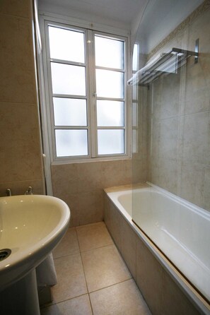 Combined shower/tub, hair dryer, towels, toilet paper