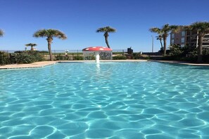 Outdoor pool, a heated pool - Oceanview luxury condo (Galveston)