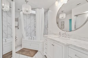 Bathtub, hair dryer, towels, soap