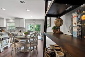 Enjoy meals in the kitchen with a round dining table and stainless steel appliances.