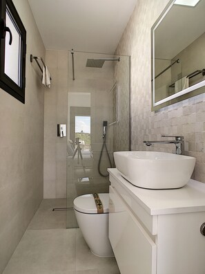 Shower, hair dryer, towels, toilet paper
