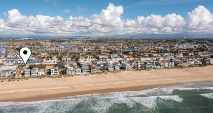 Across quiet street from sandy beach.