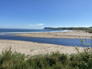 A beach with clear skies and calm waters.