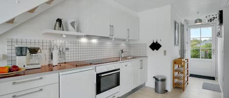 Fridge, stovetop, dishwasher, coffee/tea maker