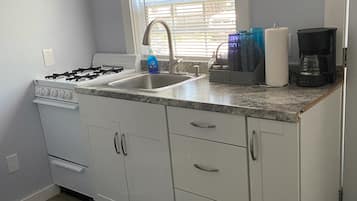 Fridge, microwave, stovetop, coffee/tea maker