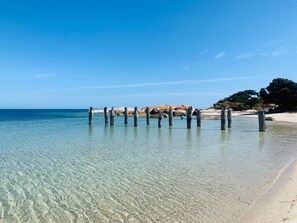 On the beach, sun-loungers, beach towels