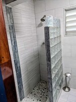 Shower, hair dryer, towels, soap