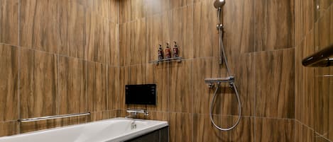 A modern bathroom with a wooden wall, a bathtub, a shower, and a control panel.