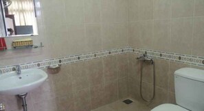 Shower, free toiletries, slippers