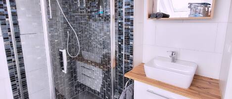 Shower, hair dryer, towels, soap