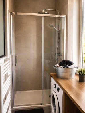 Shower, hair dryer, towels, soap