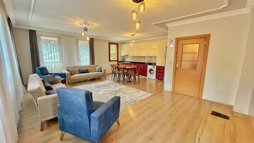 Lake View King Suite | Living area | 82-cm LCD TV with satellite channels, TV, heated floors