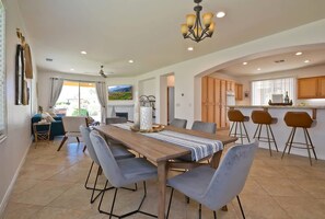 Dining table for the group next to the breakfast bar - Walk to Coachella · Private Pool & Spa · 3BR/3BA (Indio)