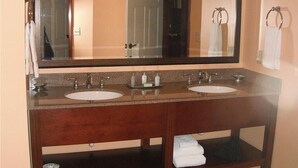 A bathroom with two sinks, a large mirror, and a towel rack. - Tamarack Club Holiday Valley Condo 1BR 1BA Ski In Ski Out Golf Sleeps 4 (Ellicottville)