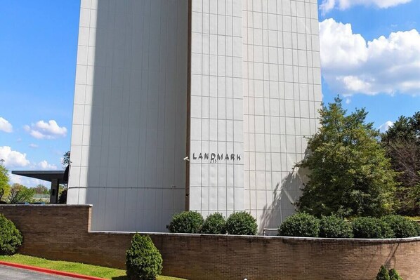 A modern building with a grid-like facade and the word "LANDMARK" on it.