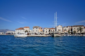 A coastal town with a marina, boats, and traditional buildings. - A1 - apt With Terrace, Best Location in Supetar (Supetar)