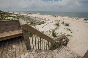 A wooden deck leading to a sandy beach with a view of the ocean. - Sea Cliffs rental with elevator SUN-SUN Rental (Port Saint Joe)
