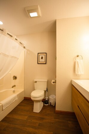 Combined shower/tub, hair dryer, towels, soap