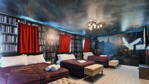 A hotel room with two beds, a large bookshelf, and a mural of a cityscape. - Avatar Game Room + Harry Potter BR w/ Pool~Spa (Kissimmee)