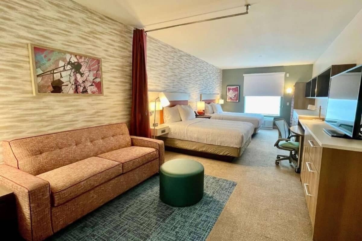 Premium bedding, Tempur-Pedic beds, desk, laptop workspace