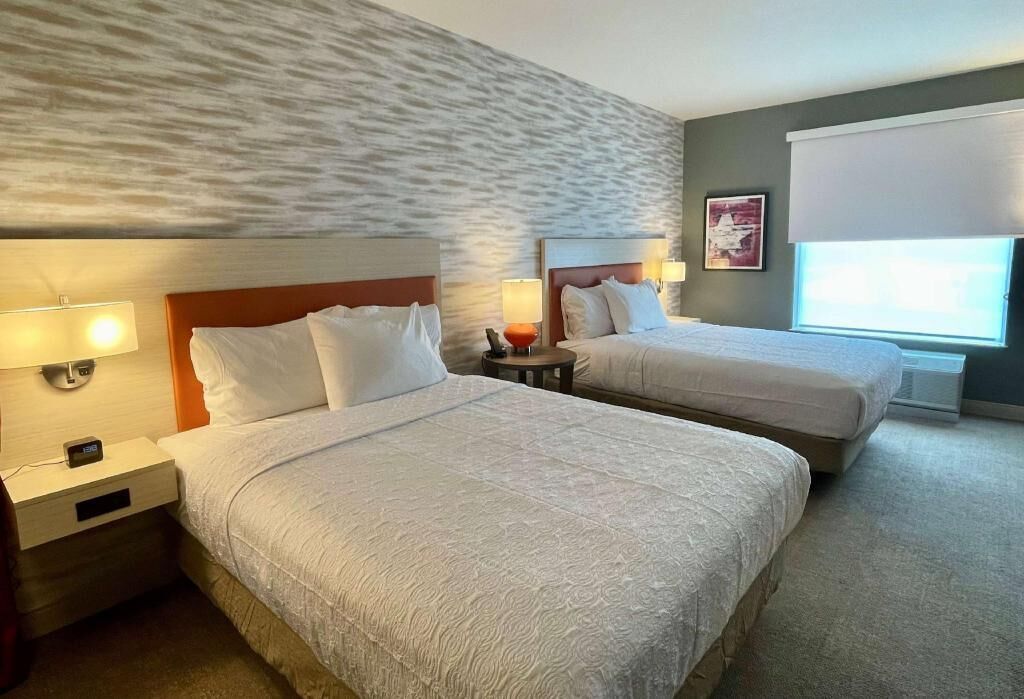 Premium bedding, Tempur-Pedic beds, desk, laptop workspace