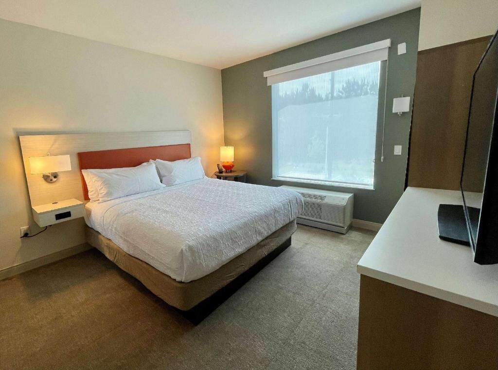 Premium bedding, Tempur-Pedic beds, desk, laptop workspace