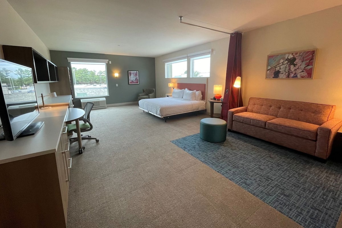 Premium bedding, Tempur-Pedic beds, desk, laptop workspace