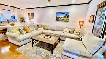 Smart TV, fireplace, books, printers