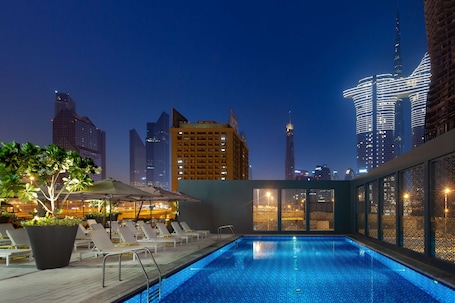 Outdoor pool, open 8:00 AM to 8:00 PM, pool umbrellas, sun loungers
