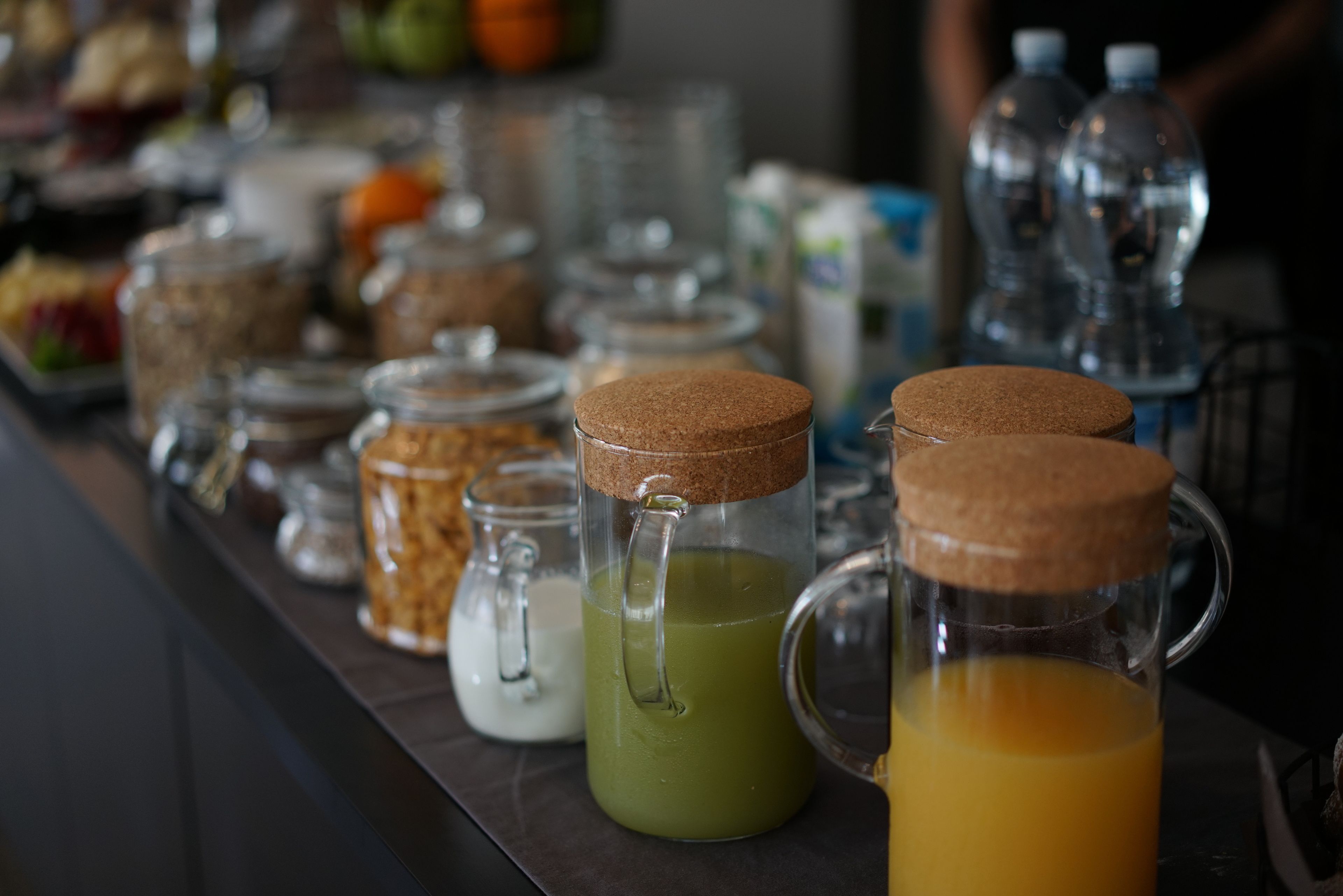 A breakfast buffet with various food items and beverages.