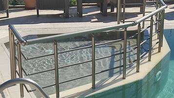 Seasonal outdoor pool, open 11:00 AM to 7:00 PM, free pool cabanas