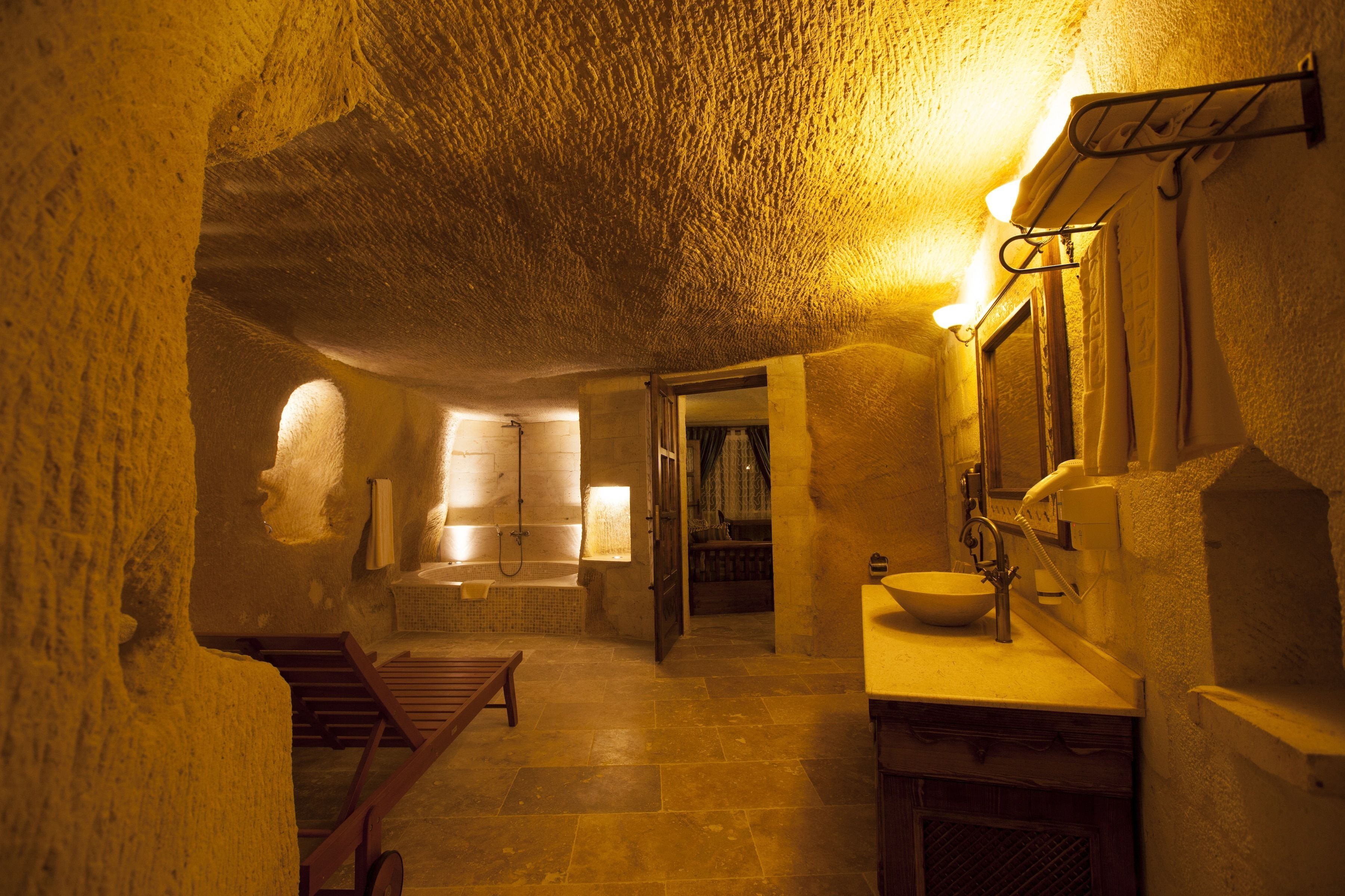 majestic cave suite | bathroom | eco-friendly toiletries, hair dryer, bathrobes, slippers