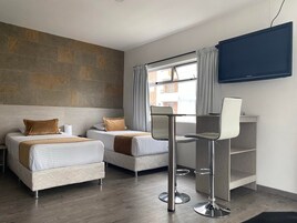 Standard Triple Room | Minibar, in-room safe, desk, laptop workspace