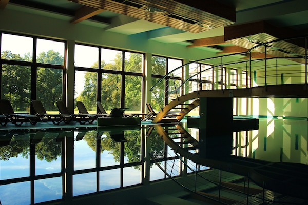 Indoor pool, open 7:00 AM to 11:00 PM, pool loungers