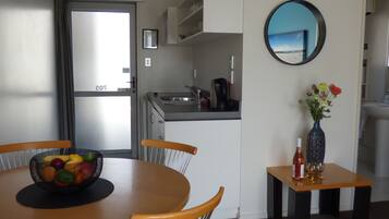 Two Bedroom Spa Apartment | Living area | 35-inch LCD TV with satellite channels, TV, DVD player