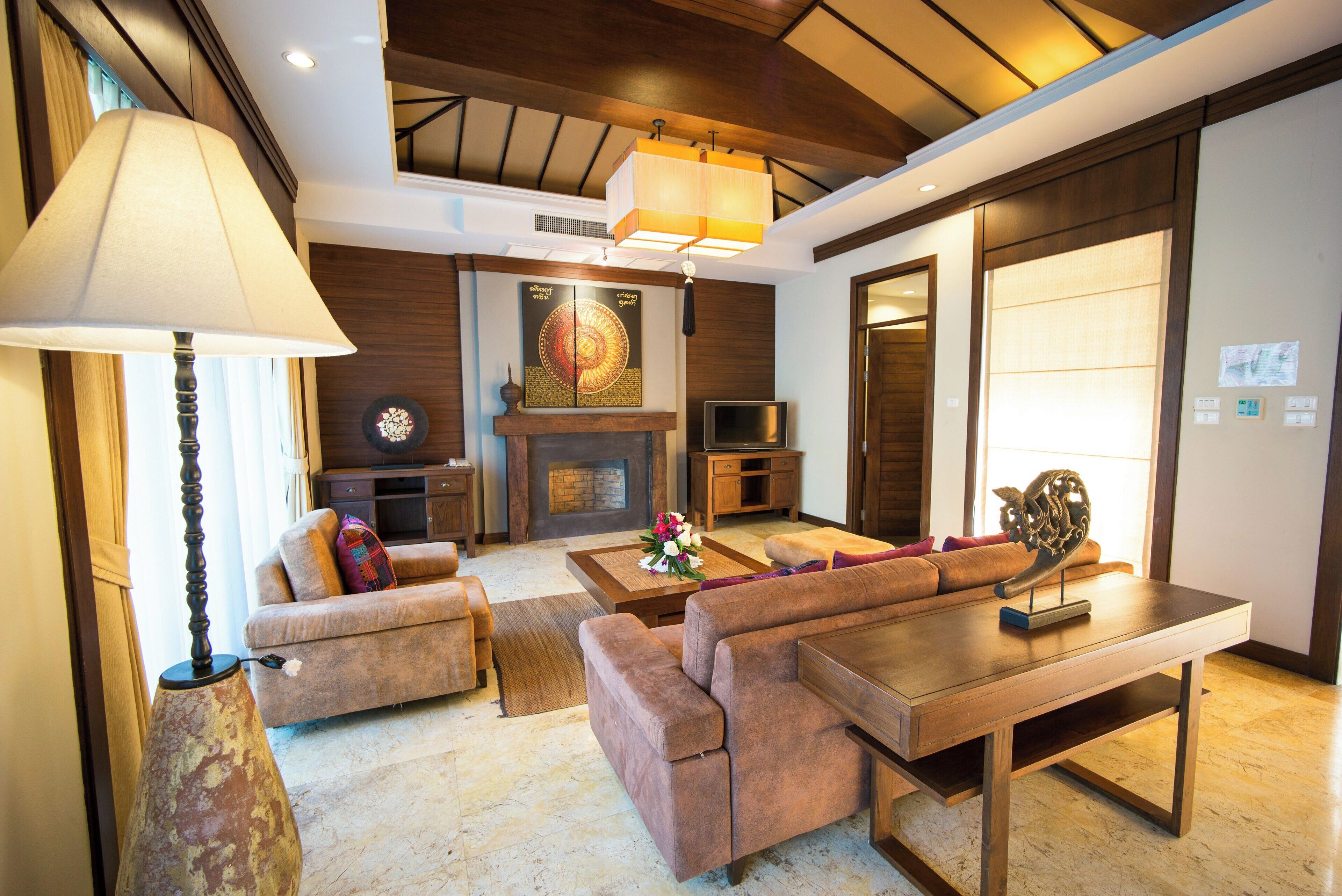 family villa, 1 king bed, pool access | living area | tv