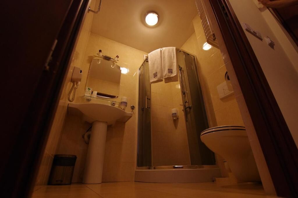 shower, rainfall showerhead, hair dryer, towels