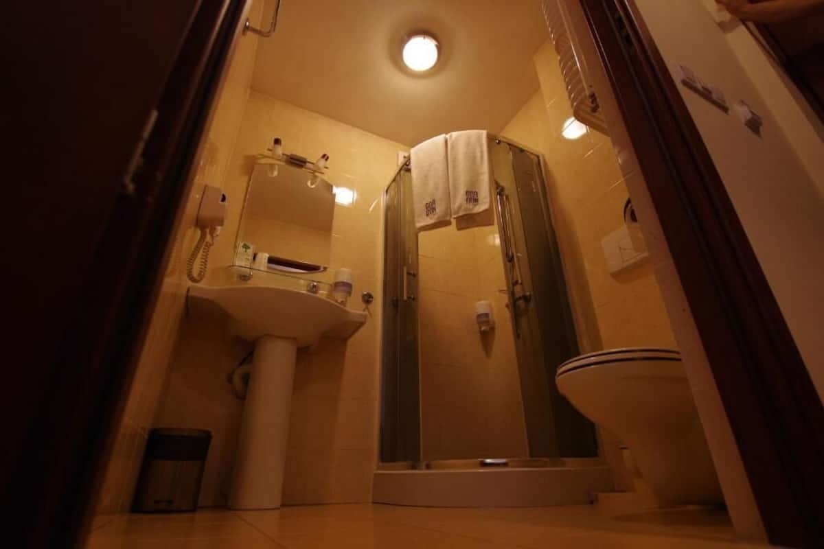 shower, rainfall showerhead, hair dryer, towels